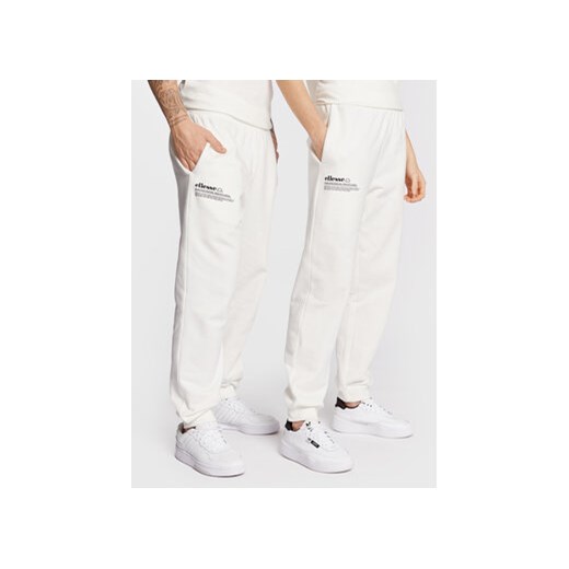 Ellesse Spodnie dresowe Unisex Dimartino SGP16249 Biały Regular Fit ze sklepu MODIVO w kategorii Spodnie męskie - zdjęcie 169191608