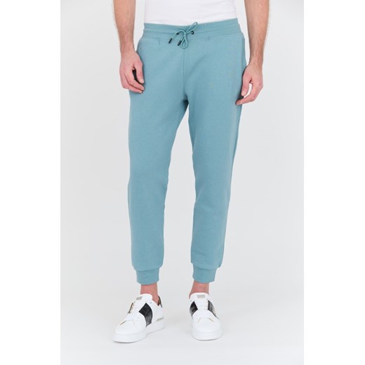 GUESS Turkusowe spodnie dresowe Aldwin, Rozmiar XL ze sklepu outfit.pl w kategorii Spodnie męskie - zdjęcie 169236968