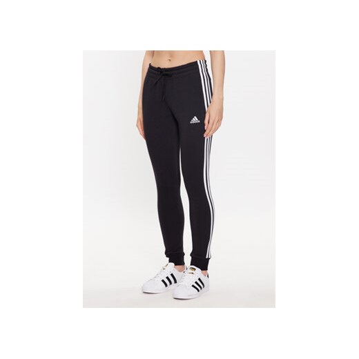 adidas Spodnie dresowe HZ5753 Czarny Slim Fit ze sklepu MODIVO w kategorii Spodnie damskie - zdjęcie 169341377