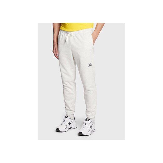 New Balance Spodnie dresowe MP23504 Szary Athletic Fit ze sklepu MODIVO w kategorii Spodnie męskie - zdjęcie 169341417