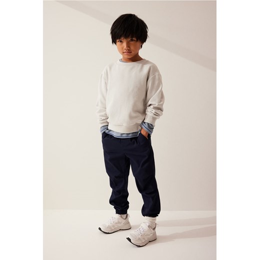 H & M - Joggersy z diagonalu - Niebieski ze sklepu H&M w kategorii Spodnie chłopięce - zdjęcie 169593076