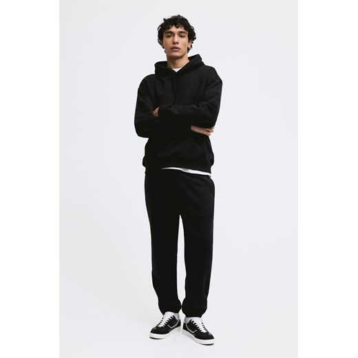 H & M - Spodnie dresowe Relaxed Fit - Czarny ze sklepu H&M w kategorii Spodnie męskie - zdjęcie 169594685