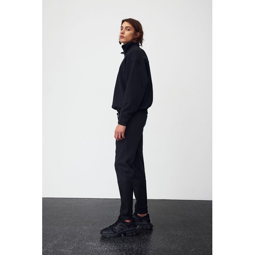H & M - Zwężane joggersy techniczne z kieszeniami DryMove - Czarny H & M XL H&M