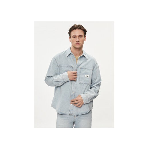 Calvin Klein Jeans Koszula jeansowa Linear J30J324894 Niebieski Regular Fit ze sklepu MODIVO w kategorii Koszule męskie - zdjęcie 169657855