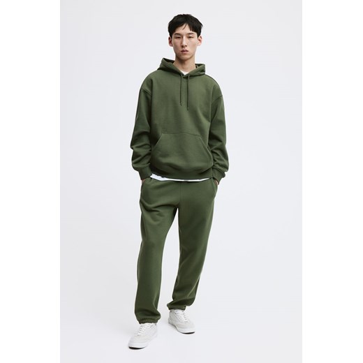 H & M - Spodnie dresowe Relaxed Fit - Zielony ze sklepu H&M w kategorii Spodnie męskie - zdjęcie 169681358