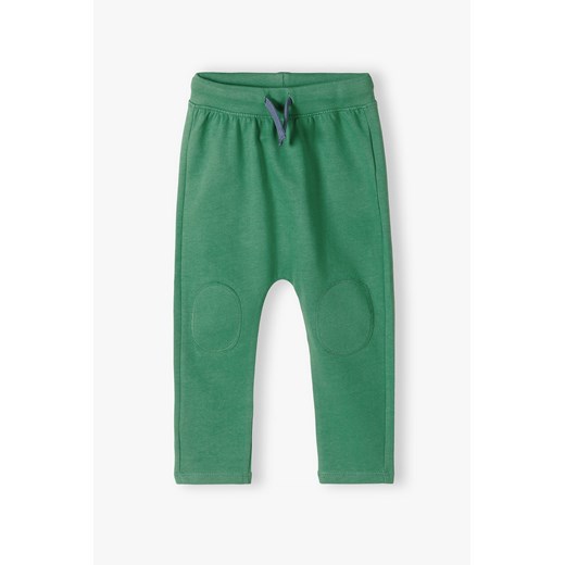 Zielone bawełniane spodnie dresowe niemowlęce ze sklepu 5.10.15 w kategorii Spodnie i półśpiochy - zdjęcie 169685808