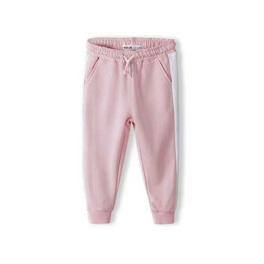 Różowe spodnie dresowe niemowlęce z białymi paskami ze sklepu 5.10.15 w kategorii Spodnie i półśpiochy - zdjęcie 169692129