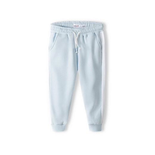 Błękitne spodnie dresowe niemowlęce z białymi paskami ze sklepu 5.10.15 w kategorii Spodnie i półśpiochy - zdjęcie 169693958
