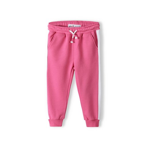 Różowe spodnie dresowe niemowlęce z białymi paskami ze sklepu 5.10.15 w kategorii Spodnie i półśpiochy - zdjęcie 169694496