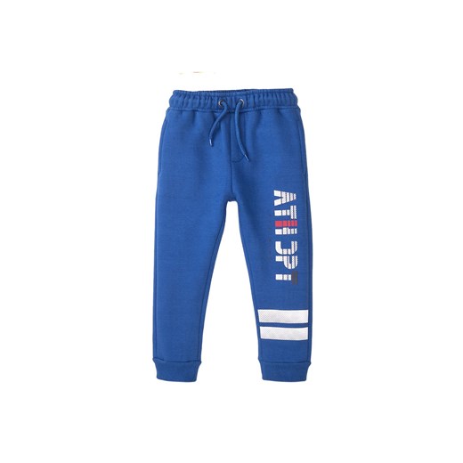 Spodnie dresowe niemowlęce niebieskie ze sklepu 5.10.15 w kategorii Spodnie i półśpiochy - zdjęcie 169699799