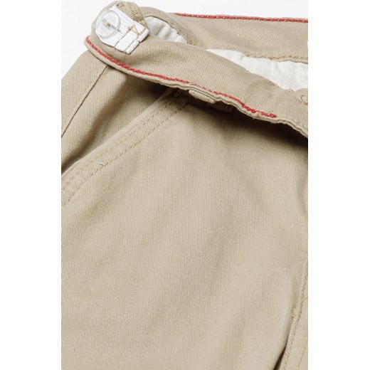 Beżowe spodnie chłopięce typu chinosy z bawełny Minoti 134/140 5.10.15