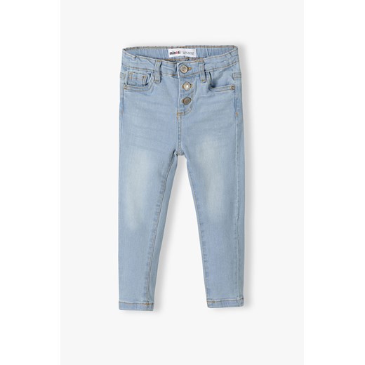 Jasnoniebieskie spodnie jeansowe skinny dla dziewczynki ze sklepu 5.10.15 w kategorii Spodnie dziewczęce - zdjęcie 169705928