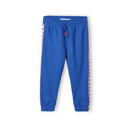 Niebieskie spodnie dresowe dziewczęce z lampasami ze sklepu 5.10.15 w kategorii Spodnie dziewczęce - zdjęcie 169712818