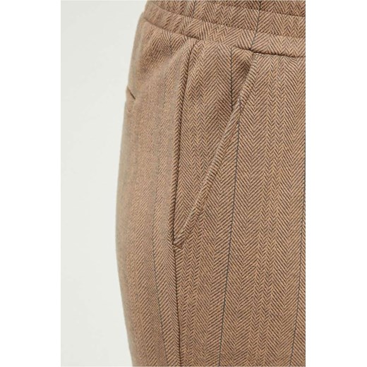 Spodnie damskie na całości zdobione wzorem w jodełkę - beżowe XS promocyjna cena 5.10.15