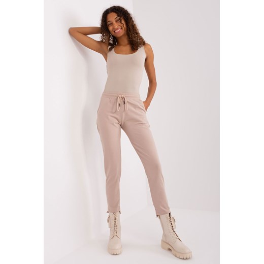 Spodnie basic z asymetrycznymi nogawkami beżowy ze sklepu 5.10.15 w kategorii Spodnie damskie - zdjęcie 169727505