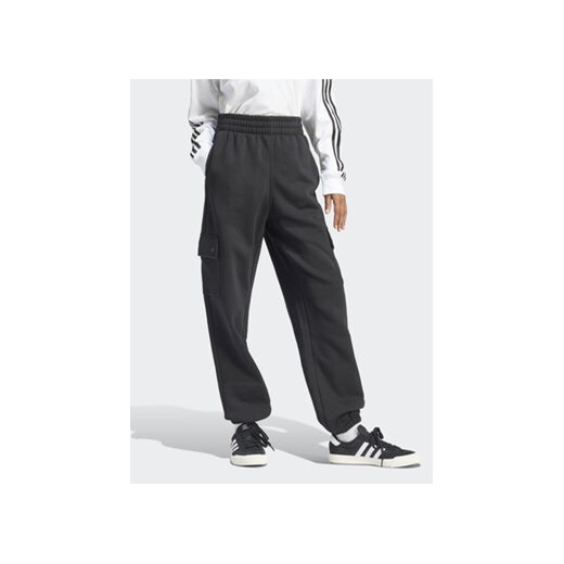 adidas Spodnie dresowe Essentials IT7576 Czarny Loose Fit ze sklepu MODIVO w kategorii Spodnie damskie - zdjęcie 169734106