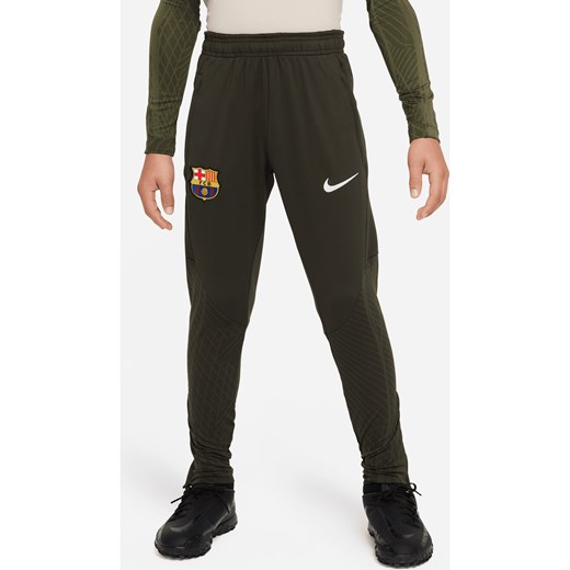 Spodnie piłkarskie z dzianiny dla dużych dzieci Nike Dri-FIT FC Barcelona Strike - Zieleń ze sklepu Nike poland w kategorii Spodnie chłopięce - zdjęcie 169754418