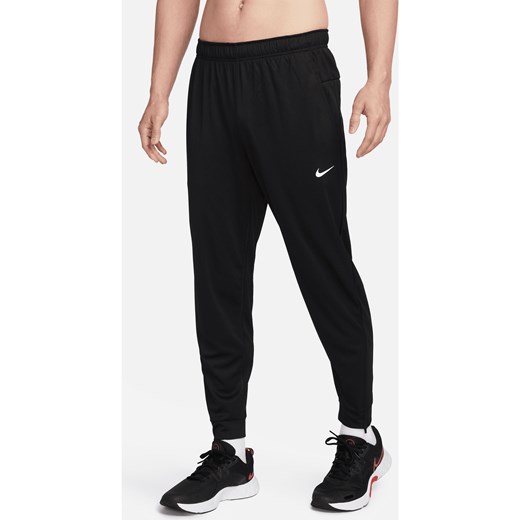 Męskie uniwersalne spodnie ze zwężanymi nogawkami Dri-FIT Nike Totality - Czerń ze sklepu Nike poland w kategorii Spodnie męskie - zdjęcie 169754707