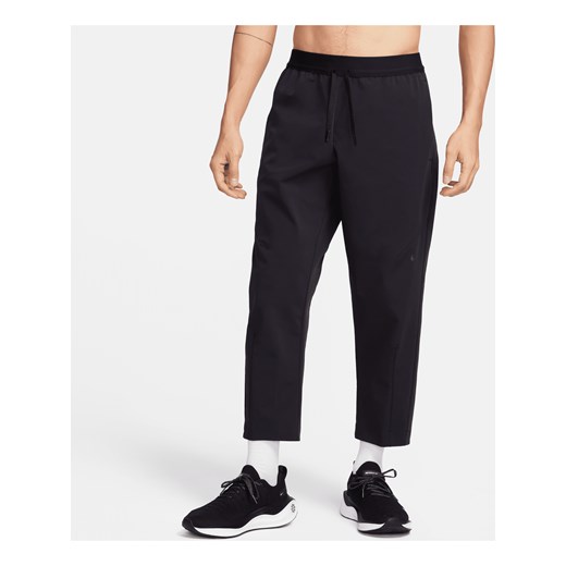 Nike A.P.S. Męskie uniwersalne spodnie z tkaniny Dri-FIT - Czerń ze sklepu Nike poland w kategorii Spodnie męskie - zdjęcie 169755146