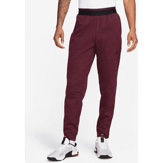 Męskie spodnie do fitnessu Nike Therma-FIT Therma Sphere - Czerwony ze sklepu Nike poland w kategorii Spodnie męskie - zdjęcie 169757157