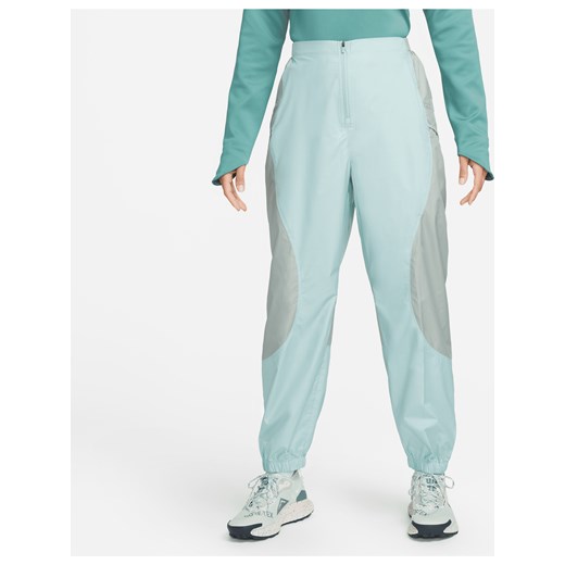 Damskie spodnie do biegów przełajowych Nike Trail Repel - Zieleń ze sklepu Nike poland w kategorii Spodnie damskie - zdjęcie 169757345