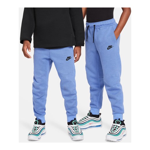 Spodnie zimowe dla dużych dzieci (chłopców) Nike Sportswear Tech Fleece - Niebieski ze sklepu Nike poland w kategorii Spodnie chłopięce - zdjęcie 169757719
