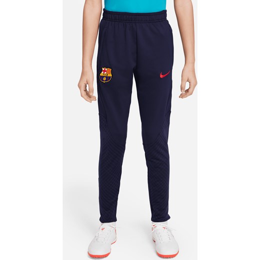 Spodnie piłkarskie dla dużych dzieci FC Barcelona Strike Nike Dri-FIT - Niebieski ze sklepu Nike poland w kategorii Spodnie chłopięce - zdjęcie 169758007