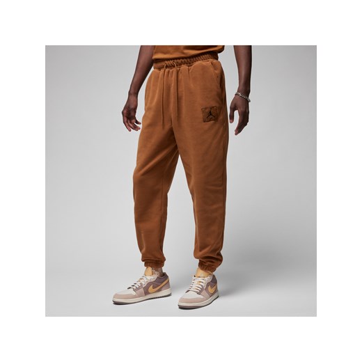 Męskie spodnie zimowe z dzianiny Jordan Essentials - Brązowy ze sklepu Nike poland w kategorii Spodnie męskie - zdjęcie 169758175