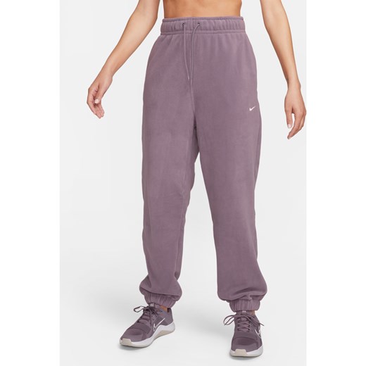Damskie luźne spodnie z dzianiny Nike Therma-FIT - Fiolet ze sklepu Nike poland w kategorii Spodnie damskie - zdjęcie 169758239
