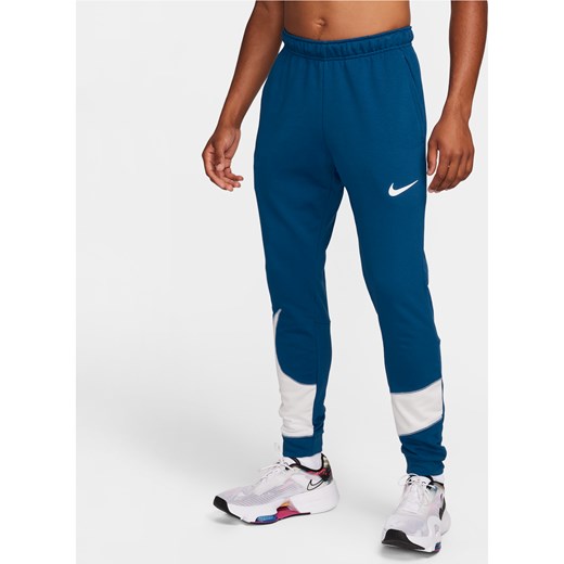 Męskie zwężane spodnie do fitnessu Nike Dri-FIT - Niebieski ze sklepu Nike poland w kategorii Spodnie męskie - zdjęcie 169758867