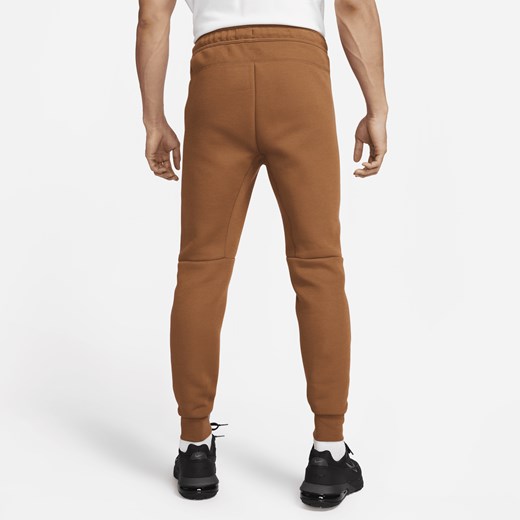 Nike spodnie męskie brązowe w sportowym stylu 