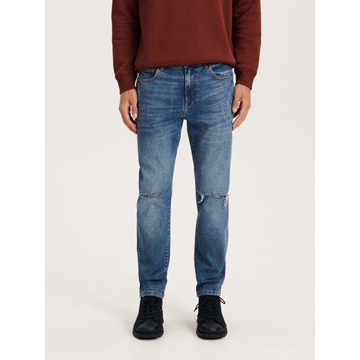 Reserved - Jeansy slim fit z dziurami - niebieski Reserved 34 promocja Reserved