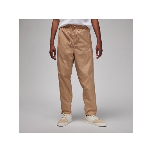 Męskie spodnie do rozgrzewki Jordan Essentials - Brązowy ze sklepu Nike poland w kategorii Spodnie męskie - zdjęcie 170057485