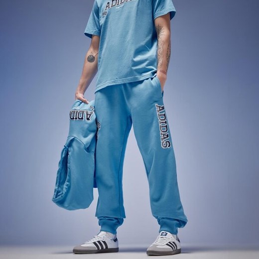 Spodnie męskie Adidas dresowe z napisami 
