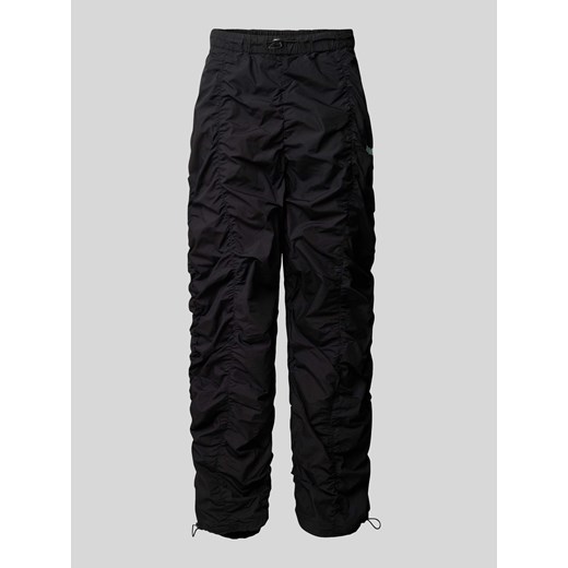 Spodnie o kroju baggy fit z marszczeniami ze sklepu Peek&Cloppenburg  w kategorii Spodnie męskie - zdjęcie 170253746