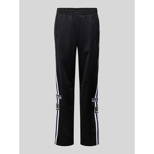 Spodnie dresowe o kroju regular fit z naszywkami z logo model ‘ADIBREAK’ ze sklepu Peek&Cloppenburg  w kategorii Spodnie męskie - zdjęcie 170342519