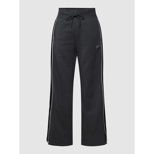Spodnie dresowe o rozkloszowanym kroju z elastycznym pasem Nike L Peek&Cloppenburg 