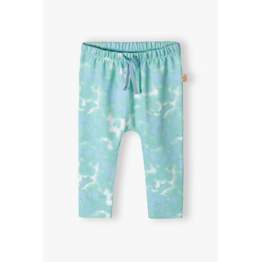 Niebieskie bawełniane wybarwiane spodnie dresowe niemowlęce ze sklepu 5.10.15 w kategorii Spodnie i półśpiochy - zdjęcie 170405266