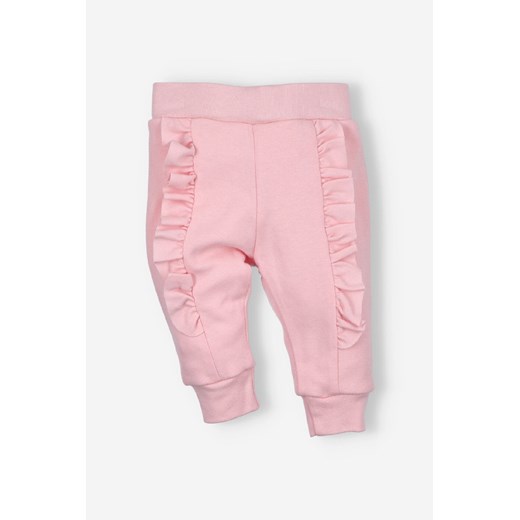 Spodnie niemowlęce PINK FLOWERS z bawełny organicznej z falbankami ze sklepu 5.10.15 w kategorii Spodnie i półśpiochy - zdjęcie 170405285