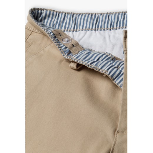 Beżowe spodnie dla chłopca - chinos - Lincoln&Sharks ze sklepu 5.10.15 w kategorii Spodnie chłopięce - zdjęcie 170431079