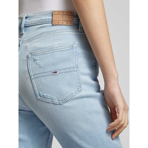 Jeansy o rozkloszowanym kroju z przetarciami model ‘SYLVIA’ Tommy Jeans 29/32 Peek&Cloppenburg 