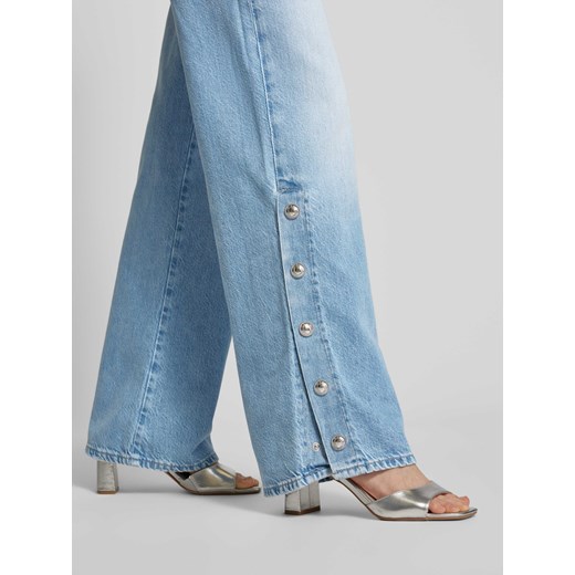 Jeansy z szeroką nogawką i naszywką z logo model ‘PAZ’ Guess 27/32 Peek&Cloppenburg 