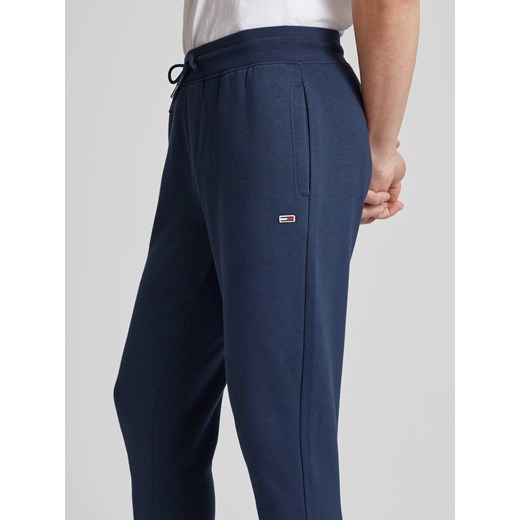 Spodnie dresowe o kroju slim fit z efektem melanżowym Tommy Jeans L Peek&Cloppenburg 