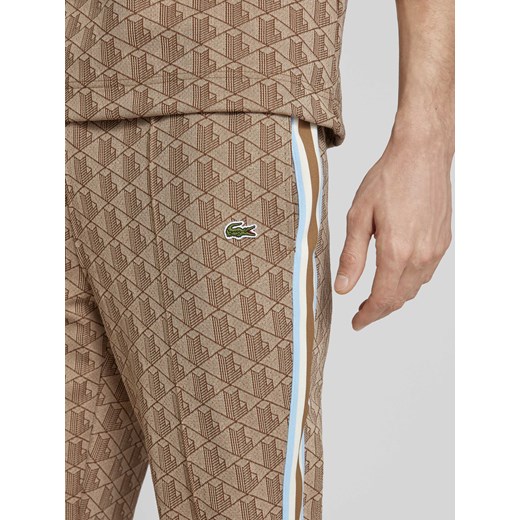 Spodnie dresowe o kroju regular fit z graficznym wzorem na całej powierzchni Lacoste XXL Peek&Cloppenburg 