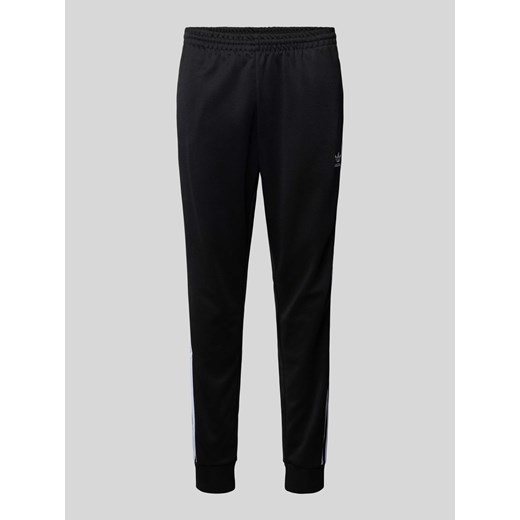 Spodnie dresowe o kroju regular fit z wyhaftowanym logo ze sklepu Peek&Cloppenburg  w kategorii Spodnie męskie - zdjęcie 170574217