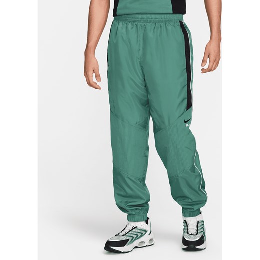 Męskie spodnie z tkaniny Nike Air - Zieleń ze sklepu Nike poland w kategorii Spodnie męskie - zdjęcie 170914105