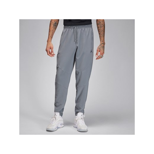 Męskie spodnie z tkaniny Dri-FIT Jordan Sport - Szary ze sklepu Nike poland w kategorii Spodnie męskie - zdjęcie 170914355