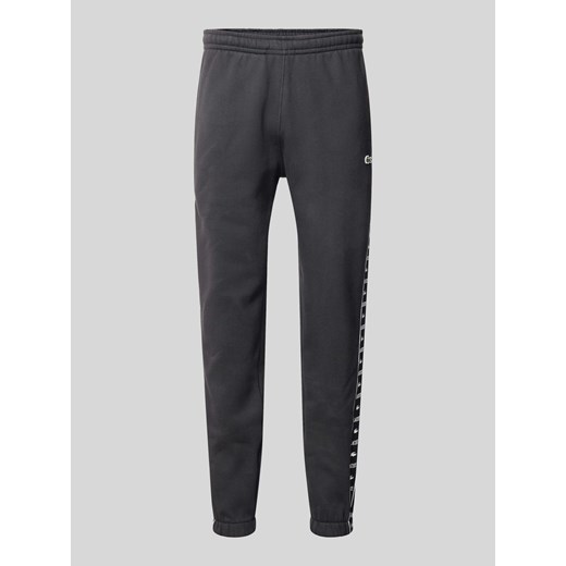 Spodnie dresowe z elastycznym ściągaczem ze sklepu Peek&Cloppenburg  w kategorii Spodnie męskie - zdjęcie 170932557