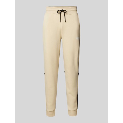 Spodnie dresowe o kroju regular fit z nadrukiem z logo model ‘ICONS’ ze sklepu Peek&Cloppenburg  w kategorii Spodnie męskie - zdjęcie 170946827