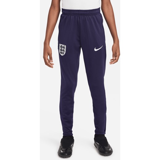 Dzianinowe spodnie piłkarskie dla dużych dzieci Nike Dri-FIT Anglia Strike - Fiolet ze sklepu Nike poland w kategorii Spodnie chłopięce - zdjęcie 171206738